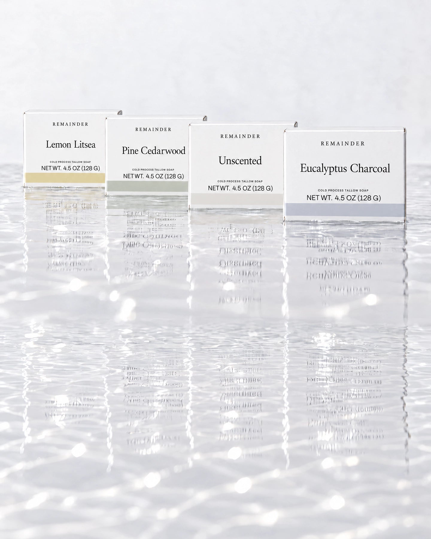 Four Remainder soap boxes standing in shallow water