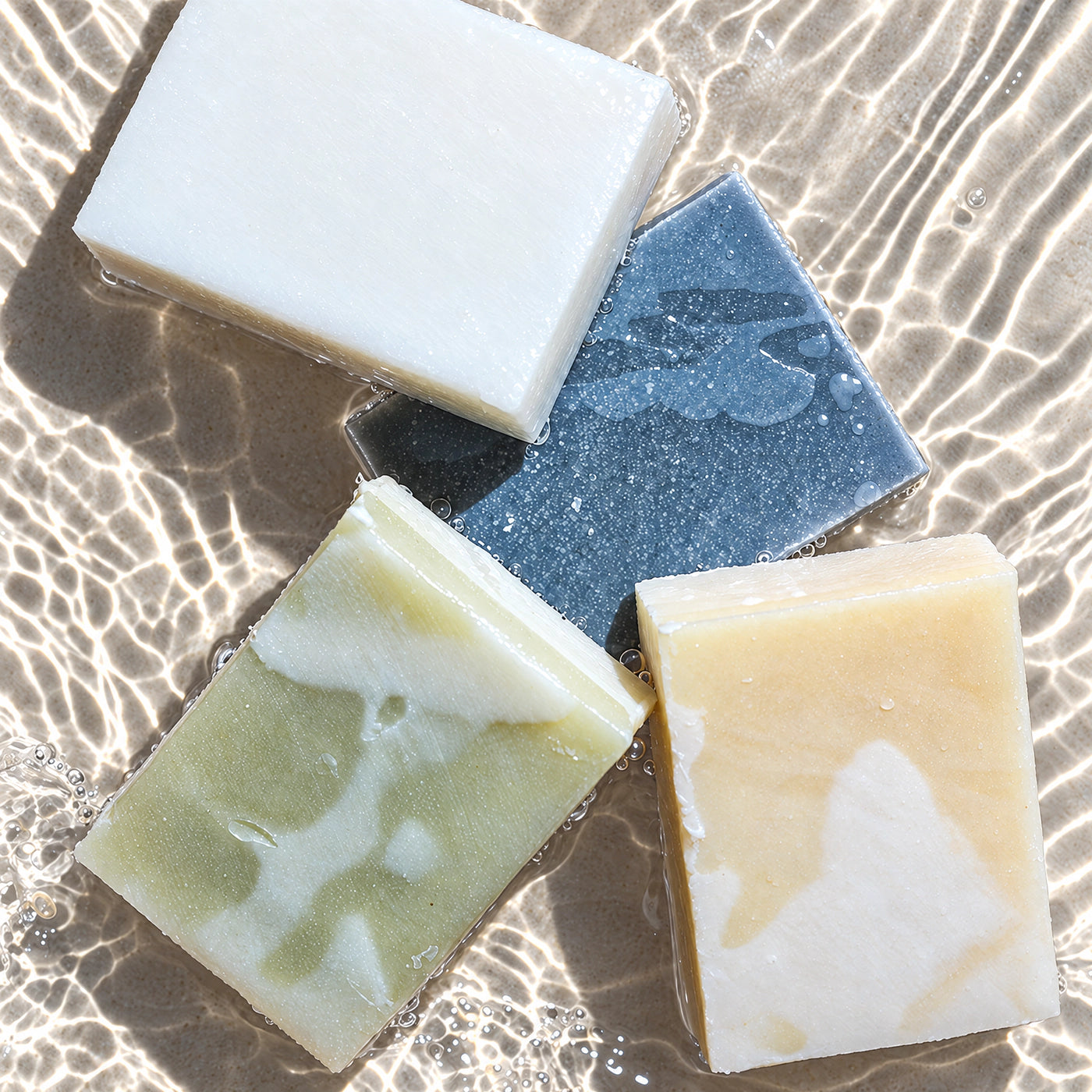 Four bars of Remainder soap in clear water